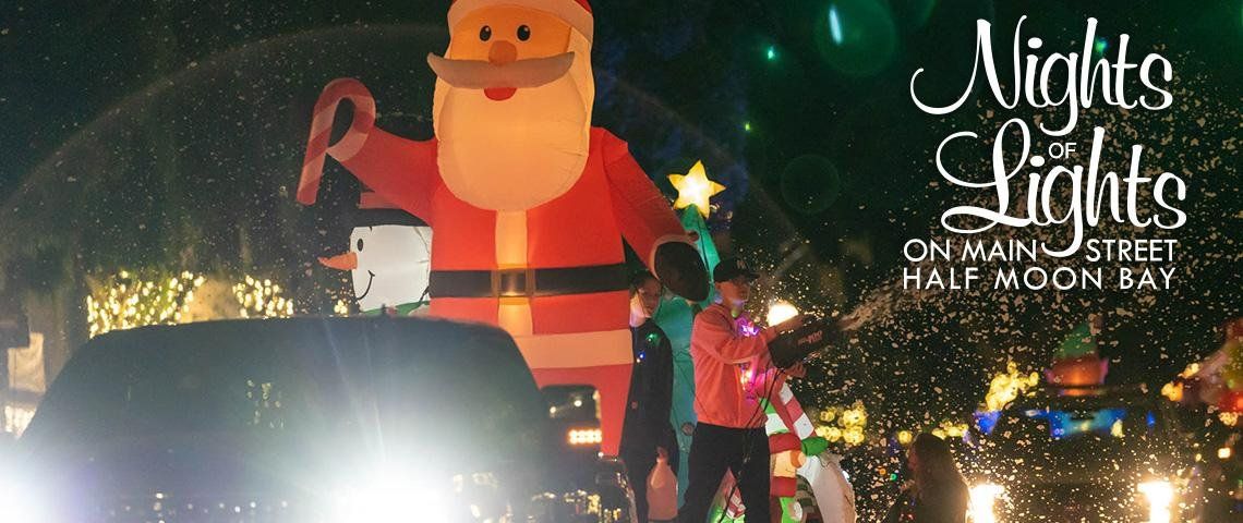 Nights of Lights on Main Street, Half Moon Bay: an inflatable Santa float in the evening parade